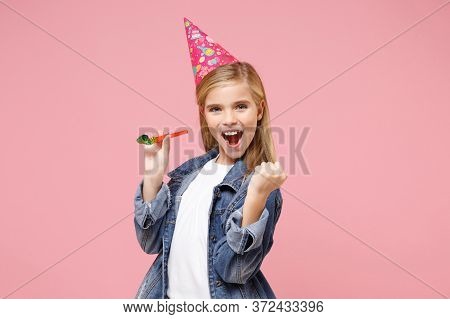 Excited Little Blonde Kid Girl 12-13 Years Old In Denim Jacket, Birthday Hat Isolated On Pastel Pink