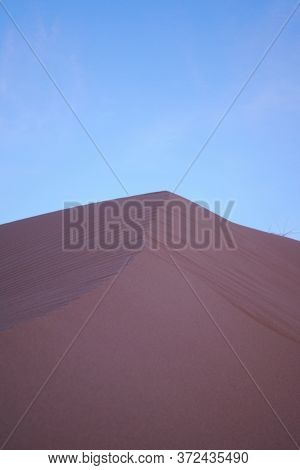 Purple Sand Dune In The Desert At Dusk, A Few Minutes After Sunset.