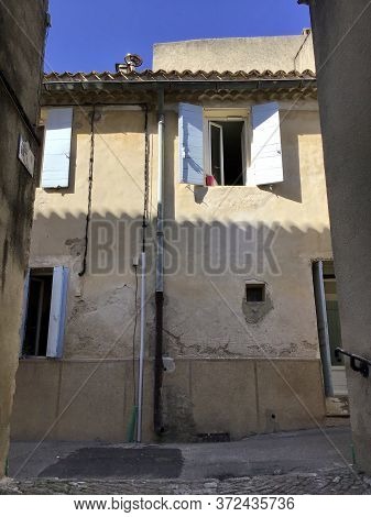 Charming Old Houses In The Narrow Streets Of Ansouis In Provence,open Windows