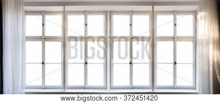 View Through Old Window Concept. Vintage White Window Pane With Frame, Handles And Sill. Sunbeams On