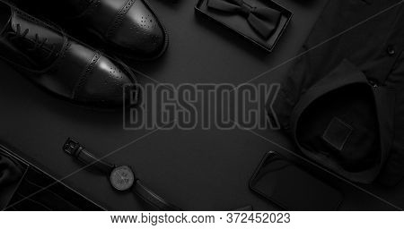 Elegant man clothes concept. Set of black wardobe and accessories for official party evening meeting