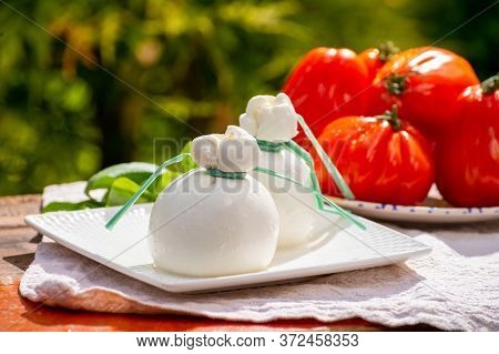 Fresh Italian Soft Cheese Burrata Or Burratina Served On Outdoor Terrace In Sunny Day