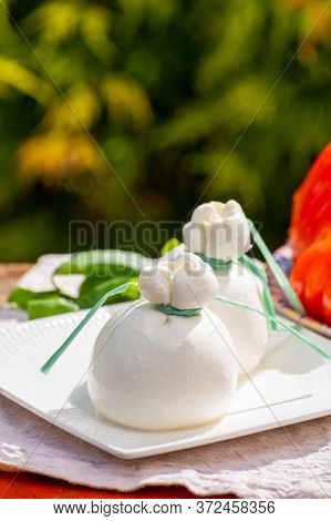 Fresh Italian Soft Cheese Burrata Or Burratina Served On Outdoor Terrace In Sunny Day