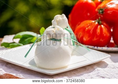 Fresh Italian Soft Cheese Burrata Or Burratina Served On Outdoor Terrace In Sunny Day