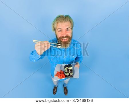 Sushi. Japanese Food. Pickled Ginger. Man Eating Japanese Food. Bearded Man With Sushiroll. Man Eati