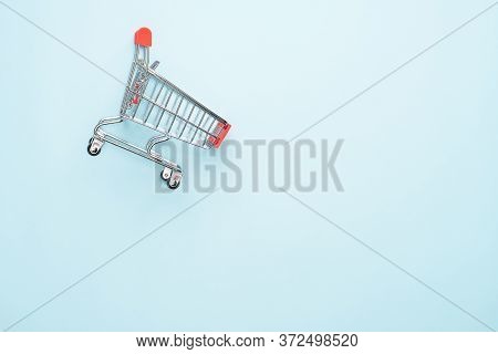Shopping Cart Isolated On Blue Background