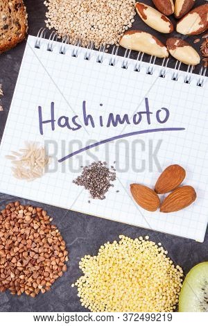 Notepad With Inscription Hashimoto And Best Ingredients Or Products For Healthy Thyroid. Food As Sou