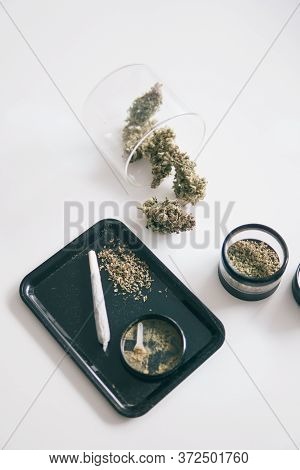 Kief In Grinder White Background. The Pot Leaves On Buds Thc Cbd. Close Up Vertical Shot.