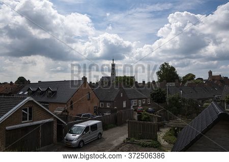 Hulst, The Netherlands, June 20, 2020, The Fortified City Of Hulst With The Basilica And A Sky Full 