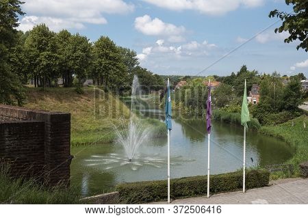 Landscape Of The Ramparts And Canals Around Hulst In The Netherlands With Fountain