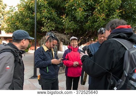 Yunnan, China February 2019. Inhabitants Of A Rural Village Amazed By The Presence Of Western Touris
