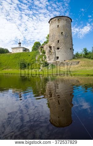 Ancient Gremyachaya Tower And Cosmodamianskaya Church On A June Afternoon. Pskov, Russia