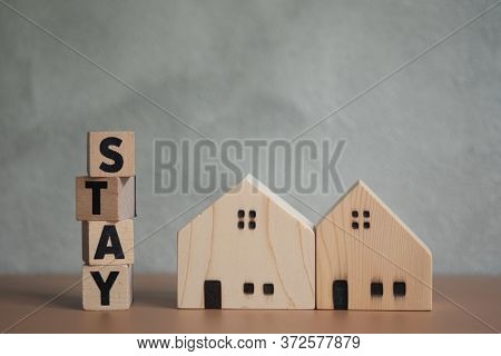 Stay Wooden Letters With Wooden Home. Concept Of Stay Home Stay Saft Quarantine And Warning