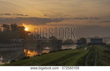 Fog And River Dyje With Orange Sunrise Near Bulhary Village In South Moravia