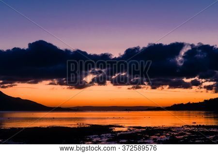 Sun Rise During Winter, Taken From Lamlash On The Isle Of Arran On The West Coast Of Scotland, Looki