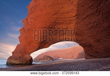 Famous Legzira Beach On Atlantic Coast In Morocco, North Africa