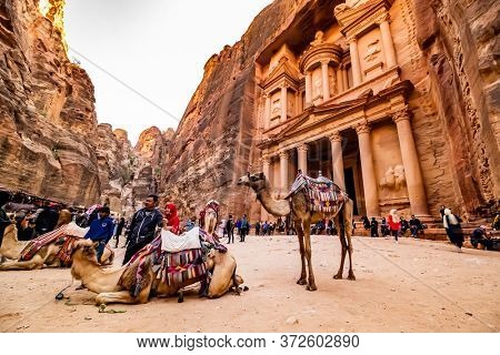 Pertra, Jordan - 29 March 2019: Large interesting tourist complex of the ancient city of Petra with tourists and camals
