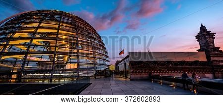 Berlin, Germany - 19 September 2020: Reichstag large glass dome and roof terrace at sunset