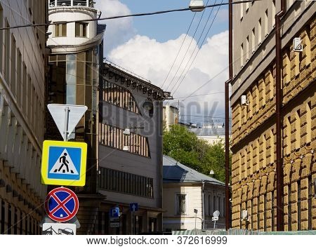City Street With One-story And Multi-story Residential Buildings Of Old Construction And A Modern Of