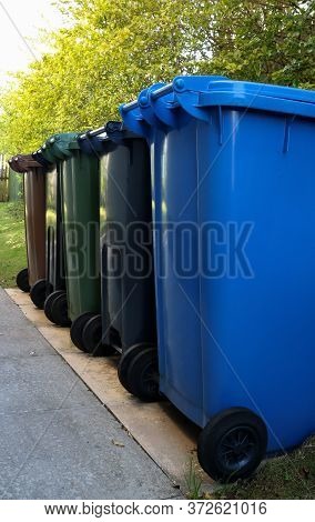Waste Disposal Recycling Bins In A House Driveway