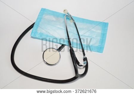 Medkit Stethoscope And Blue Disposable Medical Mask