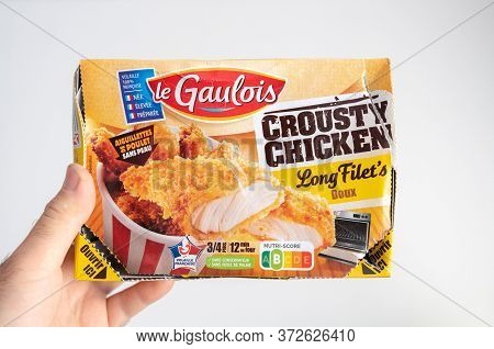 Paris, France - May 30, 2020: Male Hand Showing Against White Background Package With Le Gaulois Fre