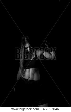 Female Boxer Training In The Dark Ring. Silhouette. Boxing Concept. Fighter Woman Fist Close Up. Sex