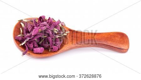 Dried Echinacea Flowers On Wooden Spoon, Isolated On White Background. Petals Of Echinacea Purpurea.