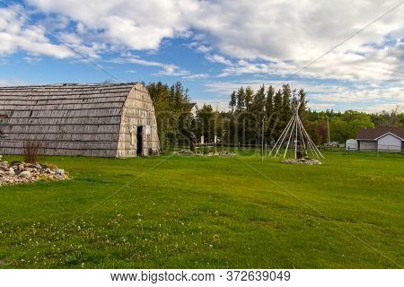 St. Ignace, Michigan, Usa - May 31, 2020: Grounds Of The Ojibwa Native American Museum In The City O