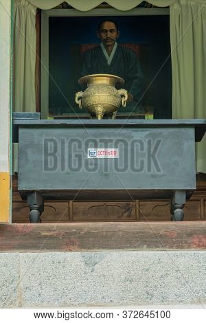 Cheongju, South Korea; May 31, 2020: Brass Urn In Front Of Portrait Of Chae Ho Sin At Entrance To Sh
