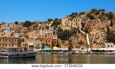 Symi, Greece - June 21, 2020: Symi Town, Symi Island, Pictorial View Of Colorful Houses And  Yialos 