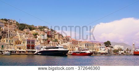 Symi, Greece - June 21, 2020: Symi Town, Symi Island, Pictorial View Of Colorful Houses And  Yialos 