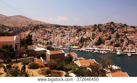 Symi, Greece - June 21, 2020: Symi Town, Symi Island, Pictorial View Of Colorful Houses And  Yialos 