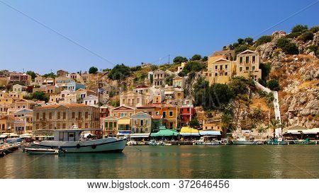 Symi, Greece - June 21, 2020: Symi Town, Symi Island, Pictorial View Of Colorful Houses And  Yialos 