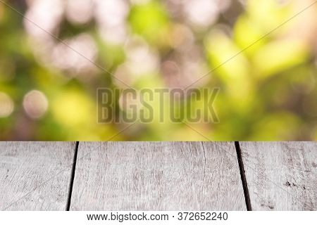 Emtry Wooden Table On Top Over Blur Natural Background, Can Be Used Mock Up For Montage Products Dis