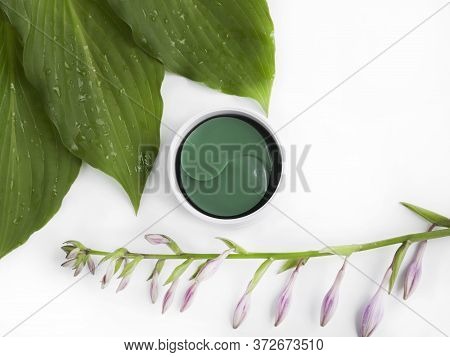 Cosmetic Hydrogel Patches For Moisturizing And Nourishing The Skin Around The Eyes On A Light Backgr