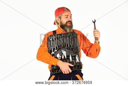 What To Carry In Your Car Toolbox. Man In Uniform Carries Toolbox White Background. Worker Repairer 