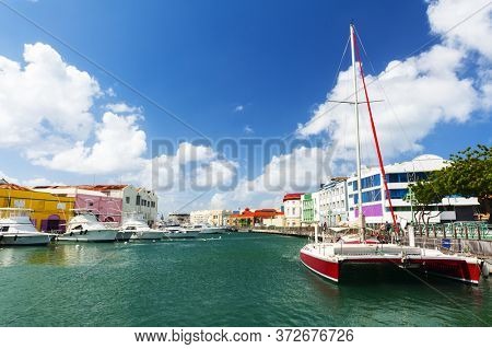 Main water canal with ships and shops in Bridgetown, capital of Barbados. Caribbean