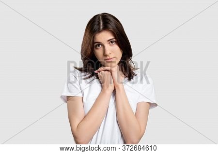 Compassionate Woman Portrait. Affection Pity. Sympathetic Lady With Hope Isolated On Light Backgroun