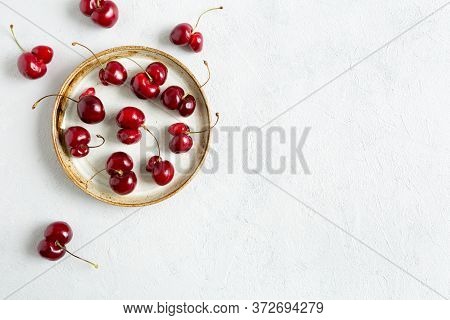 Ugly Red Cherries On White Background On Plate. Trendy Shaped Food. Misshapen Produce, Food Waste Pr