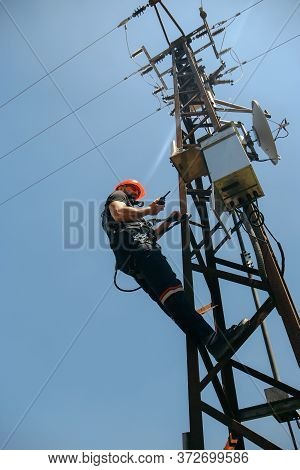 Tehnician In Red Helmet Working On 5g Antenna System