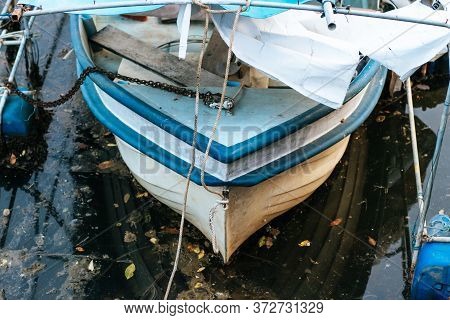 Old Fishing Boat That Has Been Parked On The River For A Long Time. Vintage.