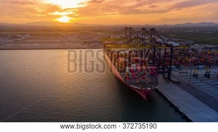 Crane Loanding Cargo Container To Container Ship In The International Terminal Yard Port  Concept Fr