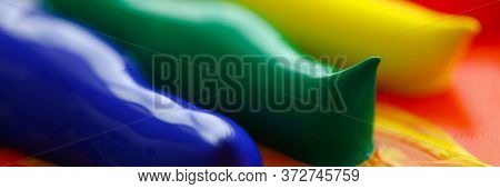 Close-up View Of Abstract Acrylic Color Brush Strokes On Canvas. Macro Shot Of Blue Green Yellow And