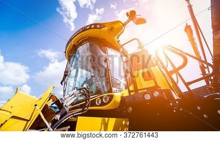 Modern Agricultural Machinery And Equipment. Yellow Agricultural Harvester.
