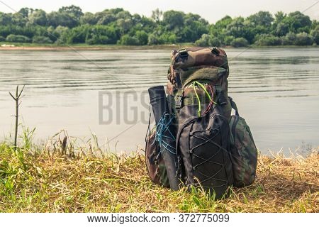 After A Long Hike The Man Stretched Out His Legs For Rest Lying On The Self-inflating Tourist Rugs