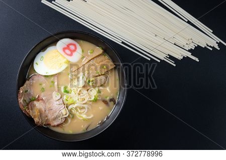Delicious Tonkotsu Ramen, Japanese Noodle In Pork Bone Based Soup Topped With Chashu Pork, Boiled Eg