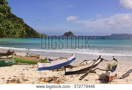 Small Fishing Boats At Mawun Beach, Lombok. Kuta Lombok Is An Exotic Paradise On The Indonesian Isla