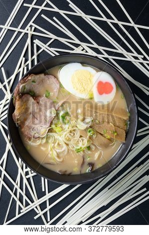 Delicious Tonkotsu Ramen, Japanese Noodle In Pork Bone Based Soup Topped With Chashu Pork, Boiled Eg