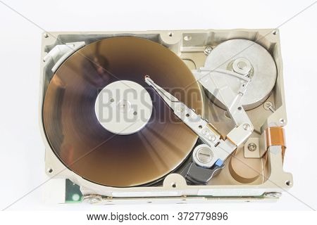 Close Up Inside Of Hard Disk On White Background. Repair And Maintenance Of Hdd - Hard Disk Drive. C